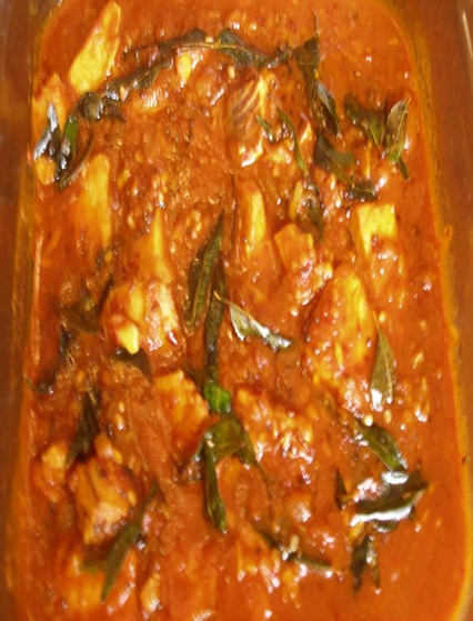 fish in tomato and basil leaves